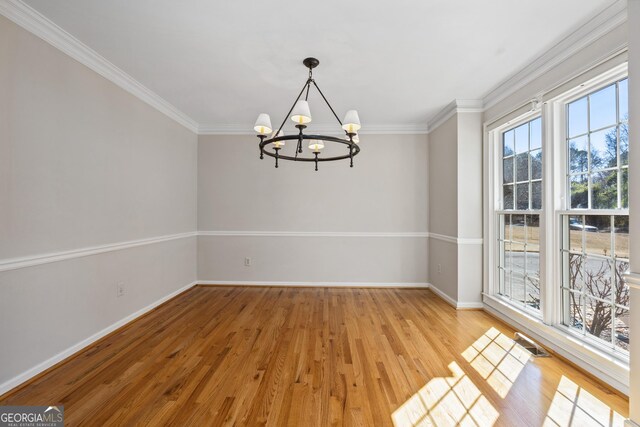 foyer entrance featuring plenty of natural light, light hardwood / wood-style floors, and a towering ceiling