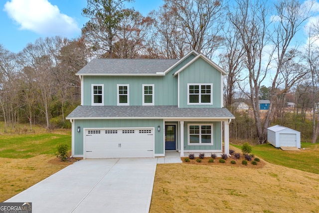 view of front of home featuring a garage and a front yard