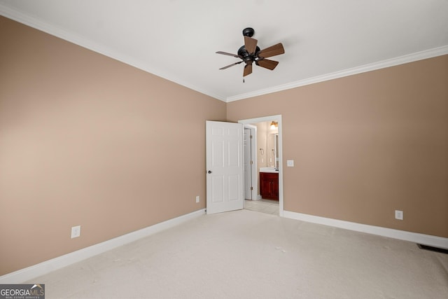 unfurnished bedroom featuring ceiling fan, crown molding, and light carpet