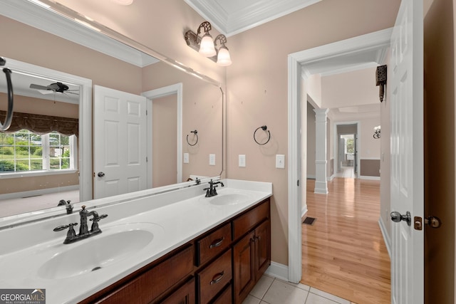 bathroom featuring vanity, tile patterned floors, ceiling fan, ornate columns, and ornamental molding