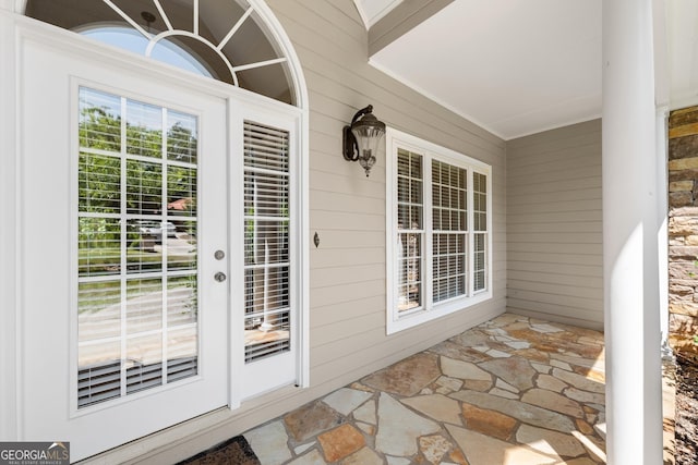 property entrance with covered porch