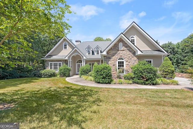 craftsman inspired home with a front yard