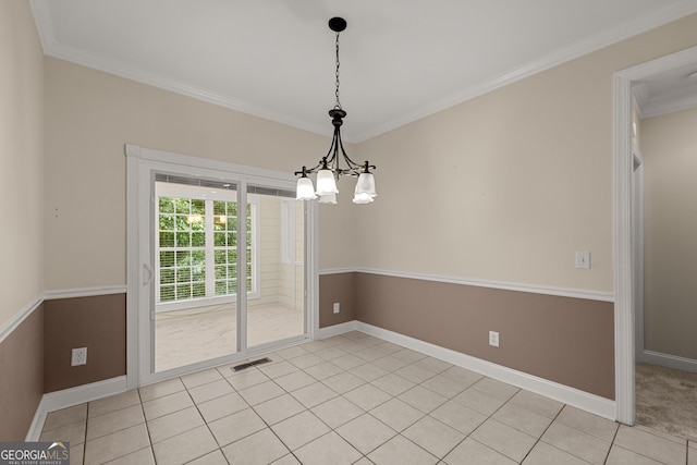 unfurnished dining area with crown molding, light tile patterned floors, and a notable chandelier