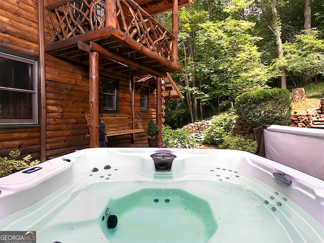 exterior space featuring a hot tub