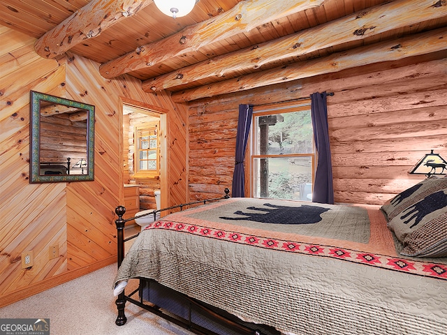 bedroom with beam ceiling, wood ceiling, and log walls