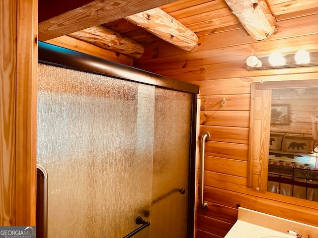 bathroom with wood ceiling and wooden walls