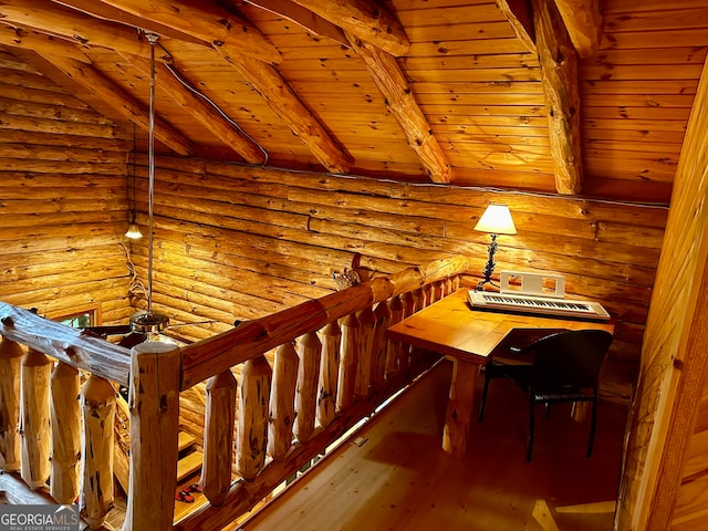 stairway featuring beamed ceiling, hardwood / wood-style floors, wood ceiling, and rustic walls