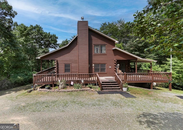 view of front of property with a wooden deck