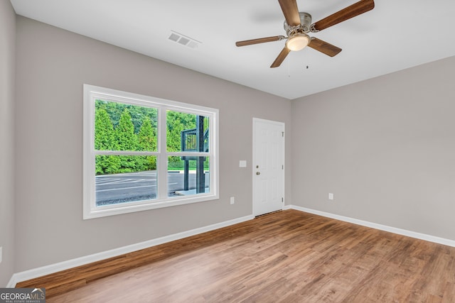 unfurnished room featuring hardwood / wood-style flooring and ceiling fan