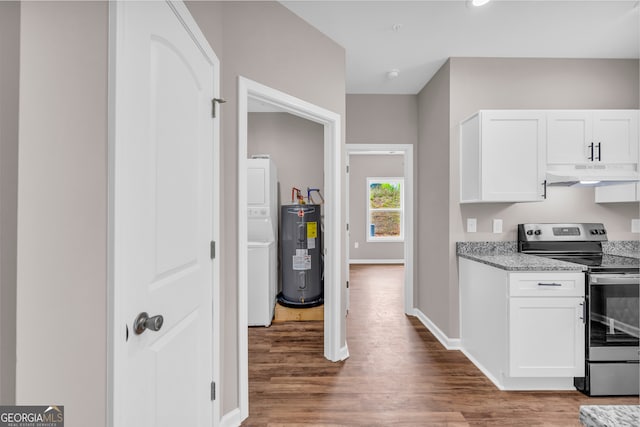 kitchen with electric water heater, white cabinets, electric stove, and hardwood / wood-style flooring