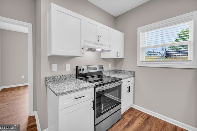 339 Gainesville, Carnesville, GA 30521 - kitchen featuring stainless steel range with electric cooktop, under cabinet range hood, baseboards, wood finished floors, and white cabinets