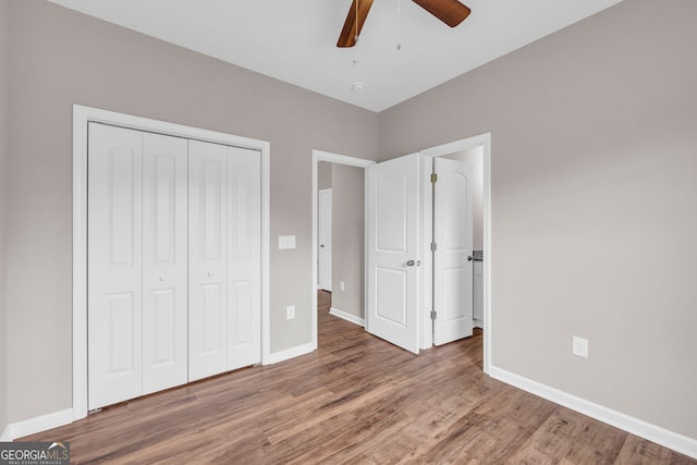 339 Gainesville, Carnesville, GA 30521 - unfurnished bedroom with a closet, wood finished floors, baseboards, and ceiling fan