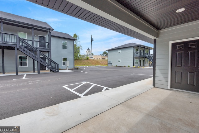339 Gainesville, Carnesville, GA 30521 - uncovered parking lot with stairway and a residential view