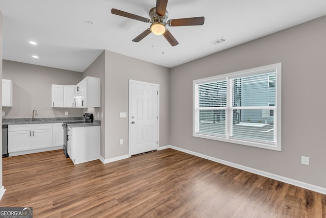 339 Gainesville, Carnesville, GA 30521 - kitchen with electric range oven, wood finished floors, baseboards, white cabinets, and ceiling fan