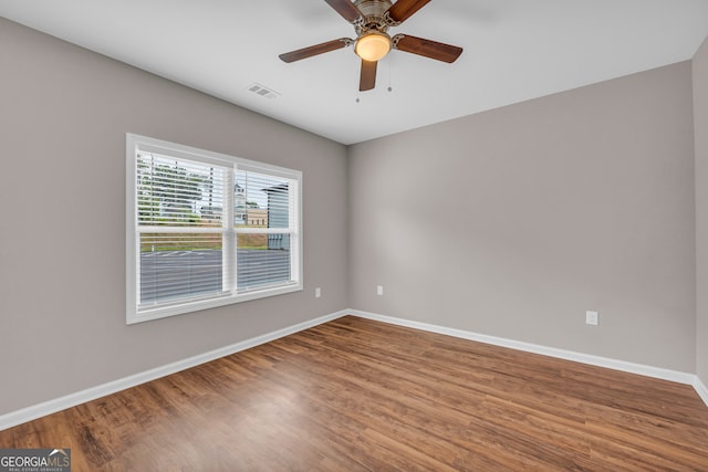 spare room featuring ceiling fan and wood-type flooring