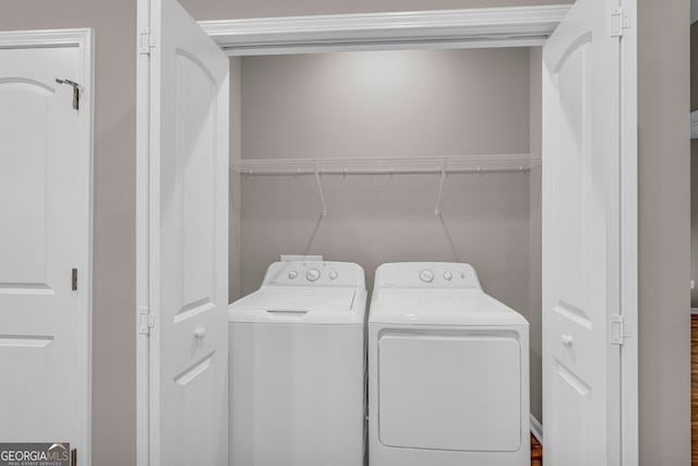 washroom featuring washer and dryer and hardwood / wood-style floors