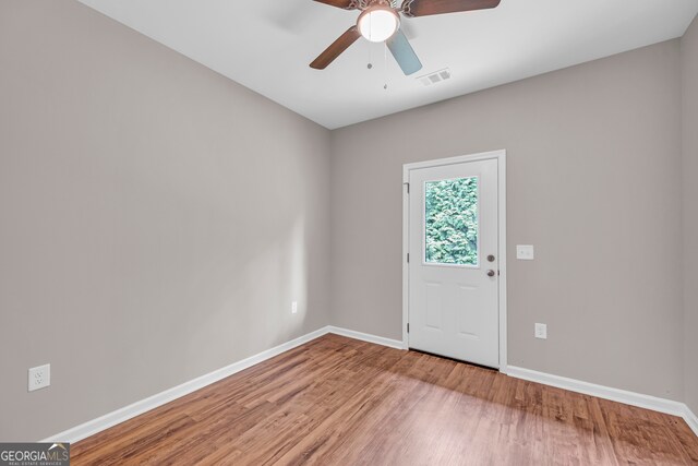 foyer entrance featuring hardwood / wood-style floors and ceiling fan