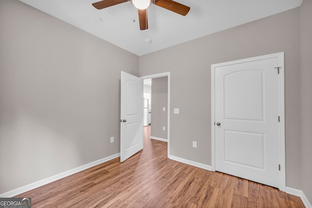 unfurnished bedroom featuring light hardwood / wood-style floors and ceiling fan