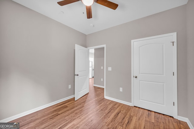 339 Gainesville, Carnesville, GA 30521 - unfurnished bedroom with light wood-style flooring, baseboards, and ceiling fan