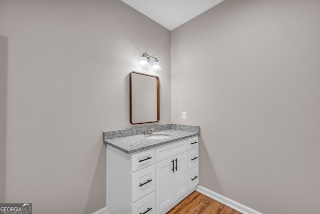 bathroom featuring hardwood / wood-style floors and vanity