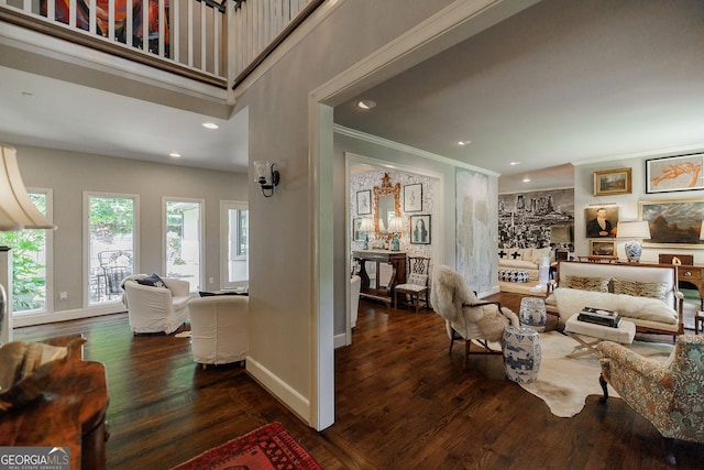 living room with crown molding and dark hardwood / wood-style floors