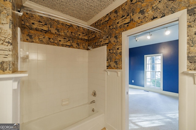 bathroom featuring  shower combination and crown molding