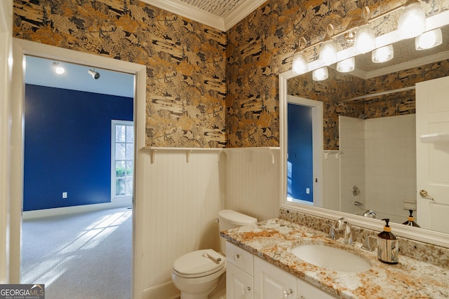 full bathroom with toilet, vanity, ornamental molding, and washtub / shower combination