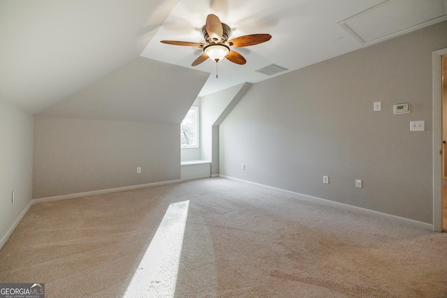 bonus room with lofted ceiling, light colored carpet, and ceiling fan