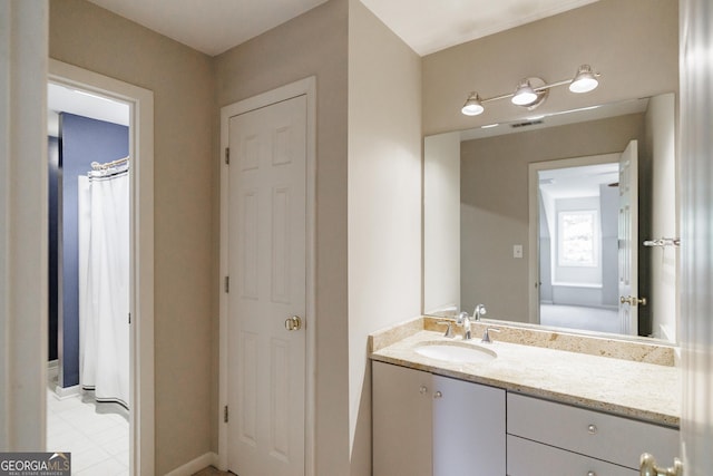 bathroom with tile patterned flooring and vanity