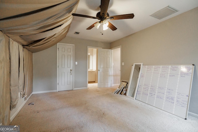 unfurnished bedroom with light carpet and ceiling fan