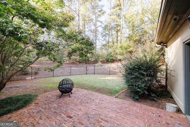 view of patio / terrace featuring an outdoor fire pit