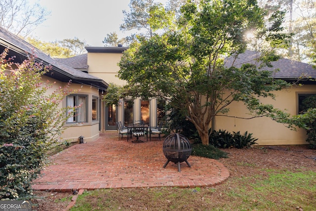 view of yard featuring a patio and a fire pit