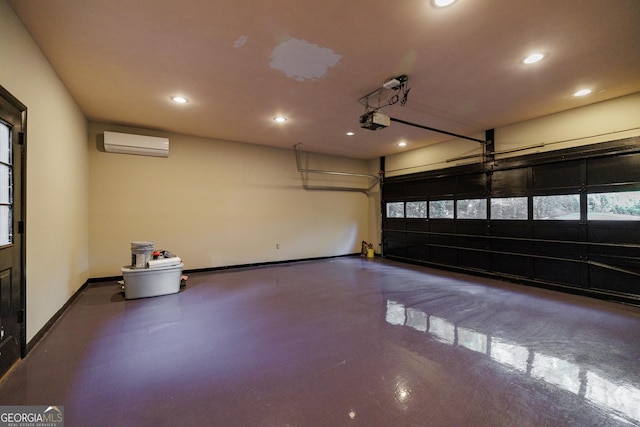 garage featuring a garage door opener and a wall mounted AC