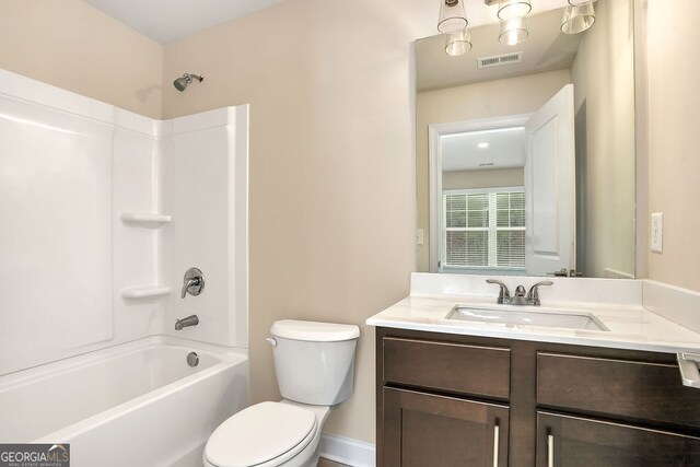 full bathroom with shower / washtub combination, vanity, and toilet