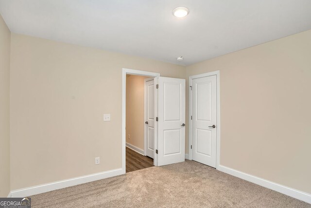 unfurnished bedroom with carpet