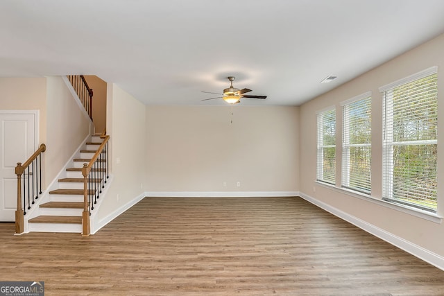 unfurnished room with light hardwood / wood-style flooring and ceiling fan