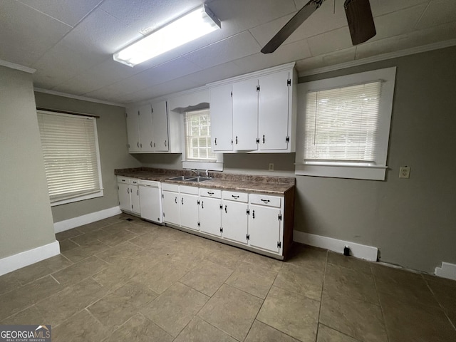 kitchen with sink, white cabinets, a healthy amount of sunlight, and white dishwasher