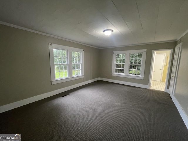 carpeted empty room featuring ornamental molding