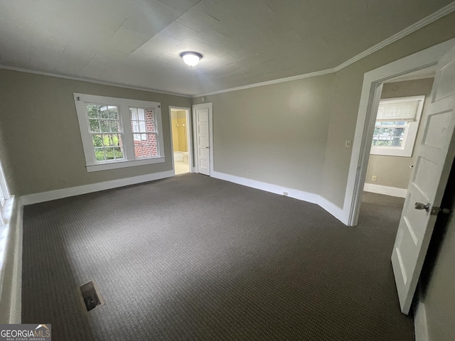 carpeted spare room featuring ornamental molding