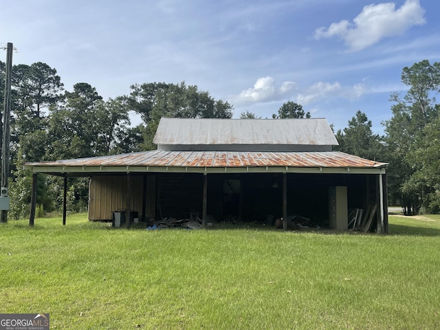 view of outdoor structure with a lawn