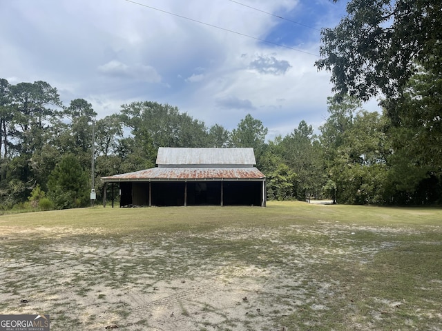 view of outdoor structure with a lawn