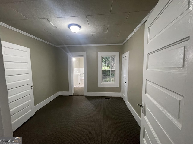 unfurnished room featuring crown molding