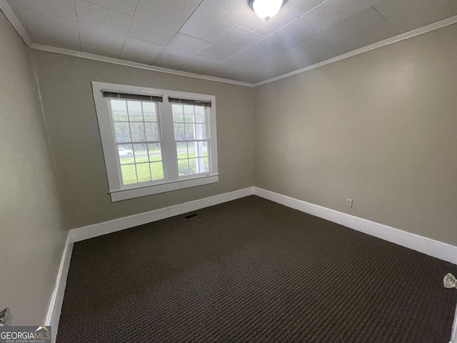 carpeted spare room with crown molding