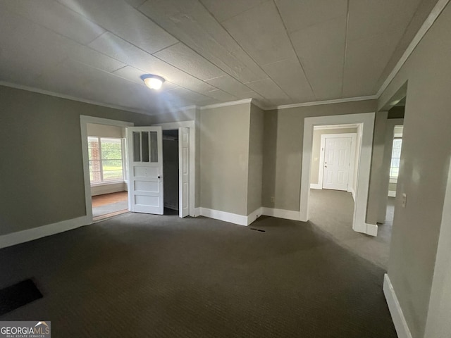 unfurnished room featuring crown molding