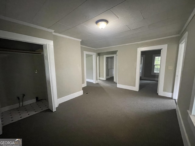 interior space featuring crown molding and carpet floors