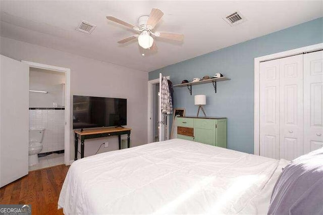 bedroom with a ceiling fan, a closet, visible vents, and wood finished floors