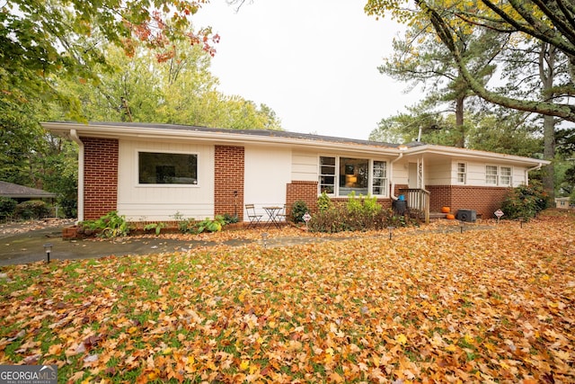 ranch-style house with brick siding