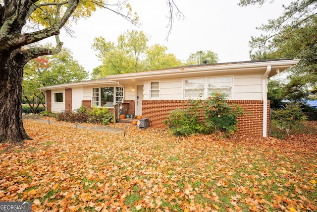 ranch-style house with brick siding