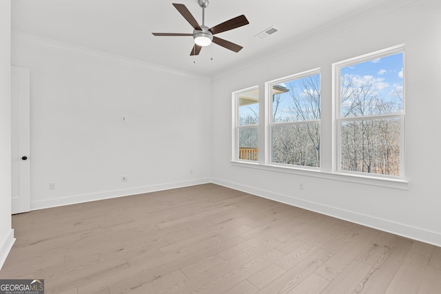 empty room featuring crown molding, ceiling fan, and light hardwood / wood-style flooring