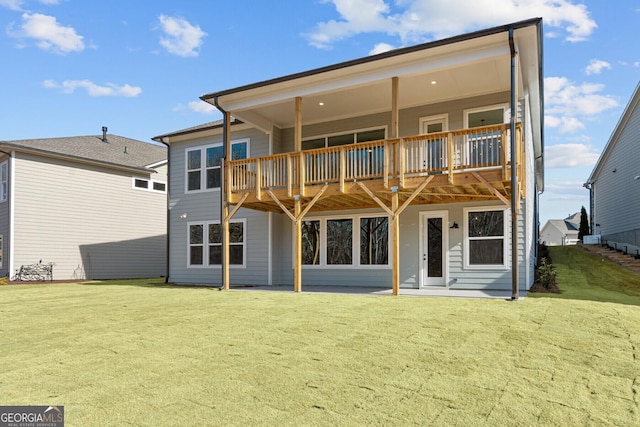 rear view of house with a yard